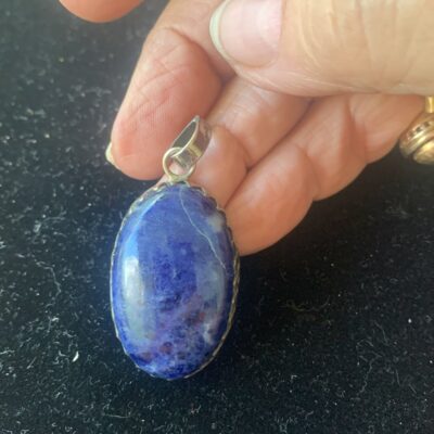 Pendant Blue Lapis Large stone encased in decorative edge. Larg bale .